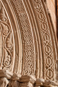 Fragment of archivolt with geometric and vegetation reliefs