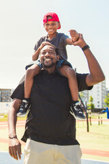 Obraz premium Father and son playing sports in sunny day at public park