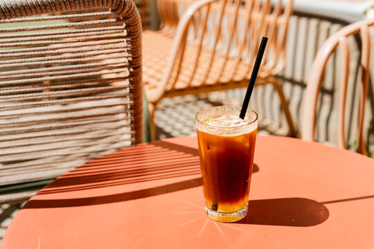 iced espresso tonic glass on a terracotta table