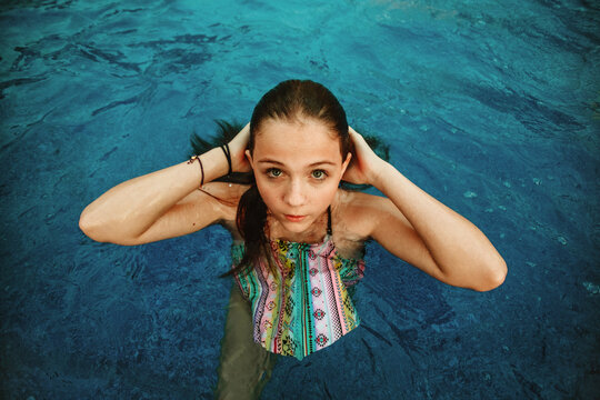 Expressive Child Portrait in a Swimming Pool Setting