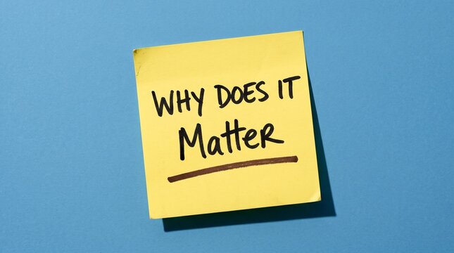 Yellow sticky note with Why Does It Matter text, handwritten message on adhesive paper, conceptual business question on blue background