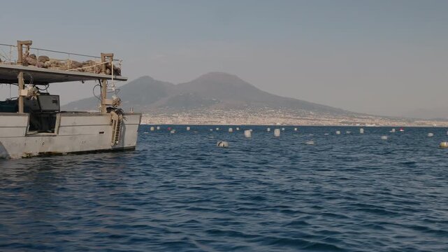 Floating buoys at a mussel farm in the Gulf of Naples, along the Mediterranean coast.