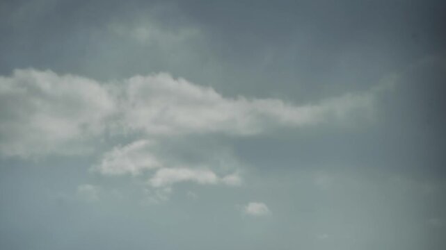 Quick cloud formation, after it rained the sky was very blue with white and gray clouds