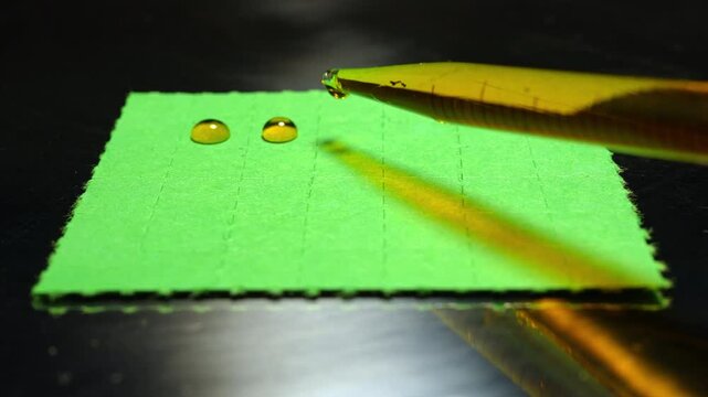 LSD blotter paper in lab setting as part of controlled psychedelic research including microdosing studies and clinical trials exploring LSD‑assisted therapy for conditions like depression and PTSD.