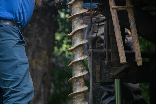 engineering geological surveys, environmental soil analysis, a drill drills into the soil	