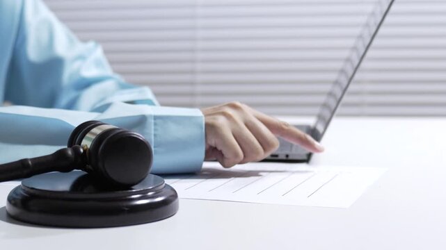 Auction gavel laptop office desk hand document contract sale judge courtroom legal hearing lawyer justice law contract office desk hand document gavel laptop auction sale judge legal law justice