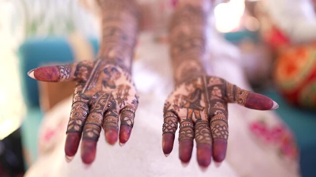 Close-Up of Indian Bride Showing Intricate Mehndi Design on Wedding Day