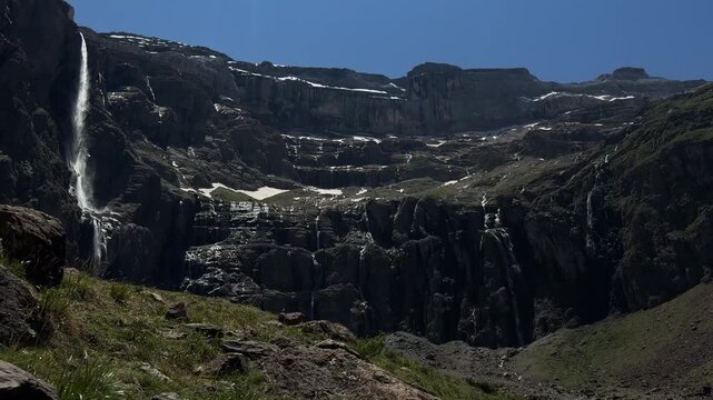 Scenic waterfall on rocky mountain cirque