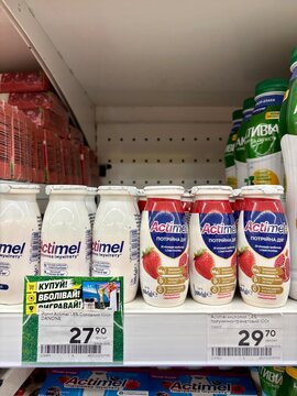 23.07.2026 Ukraine, Kharkov Actimel probiotic yogurt bottles on store shelf in close-up