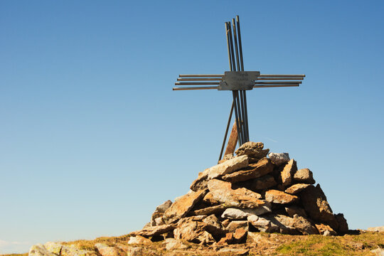 The cross on the top of Mount Masoni, a destination for hikers in the Orobie Alps, Lombardy, Italy