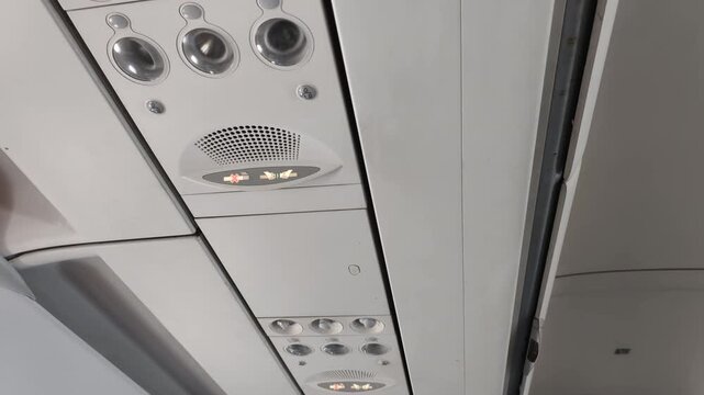 Aircraft interior details highlight modern cabin design with adjustable air vent. Aircraft interior enhance travel experience, air vent provides personal airflow, create comfortable flight environment