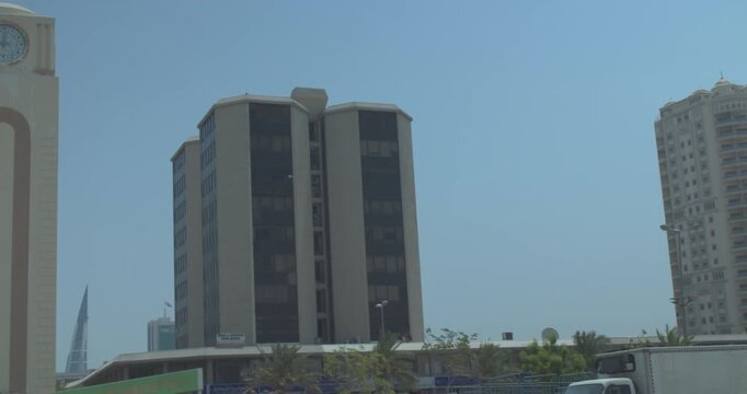 Clock Tower and Buildings in Manama