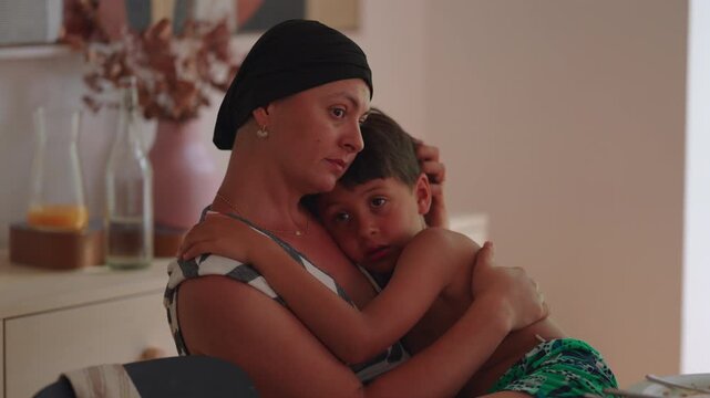 Mother embracing young son at home, offering comfort, emotional security, unconditional love and nurturing family attachment
