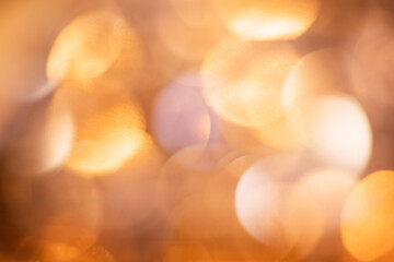 Fototapeta premium Golden glitter bokeh with warm light spots, festive