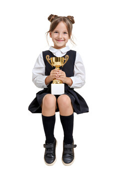 Happy schoolgirl holding a gold trophy cup isolated on transparent or white background, png