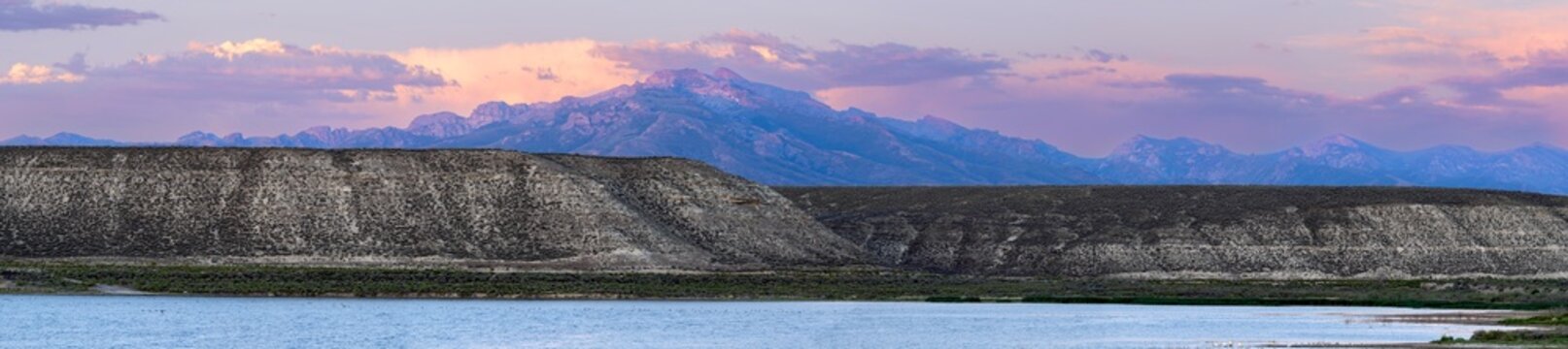 Panorama of the sunset behind the buttes above the reservoir at South Fork State Recreation Area, Spring Creek, Nevada, USA