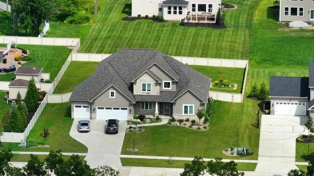 American dream homes as example of real estate development in US suburbs. View from above of residential houses in living area in Cleveland, Ohio.