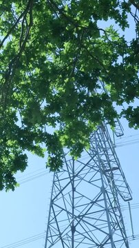 High voltage electricity transmission pylon view from below