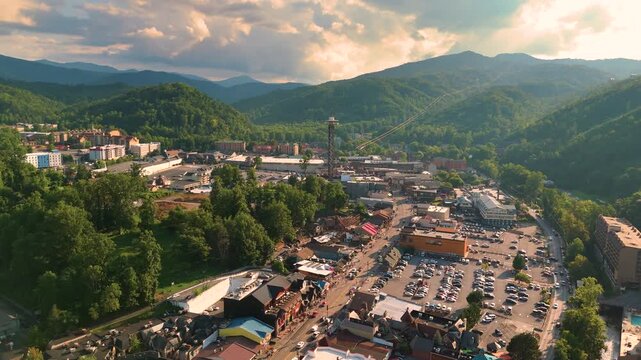 Gatlinburg, Tennessee. Popular resort town surrounded by Appalachian mountain hills, featuring the main Parkway lined with shops, restaurants, and tourist attractions.