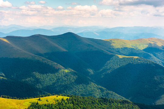 beautiful mountain landscape in summer. travel ukraine background. rolling hill in dappled light. scenic view of borzhava ridge. carpathian mountain scenery