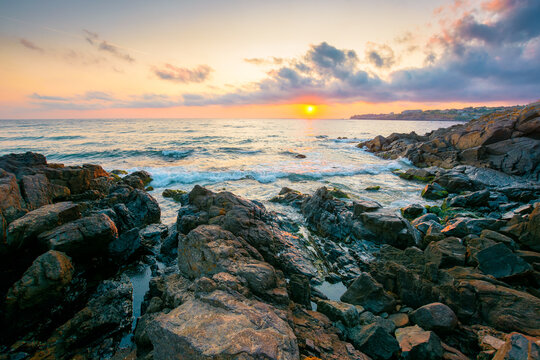 sea landscape at sunrise. rocky coast of bulgaria in summer. dramatic travel background with epic sky