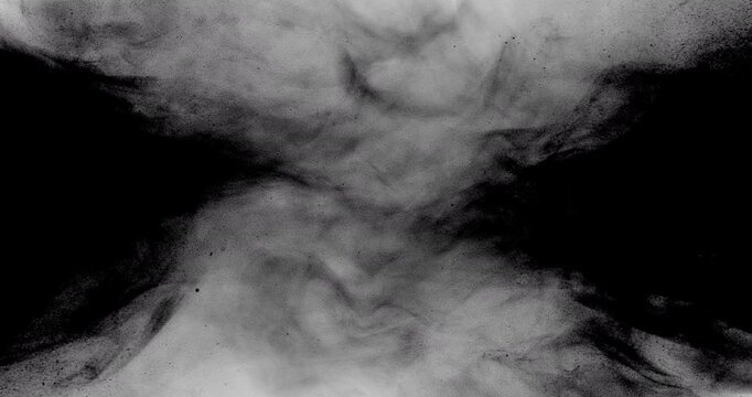 Dark smoke or powder clouds expand and collide from both sides of a black background, then explode into bright white light before receding back into darkness.