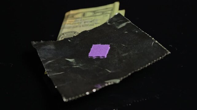 LSD acid wrapped in aluminum foil for storage and transportation. LSD usually distributed on small pieces of blotter paper. Dealers use foil as protective wrap. LSD possession distribution is illegal.