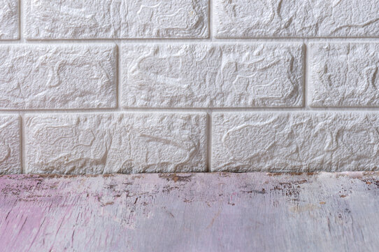 Rustic Distressed Wooden Surface with White Brick Wall Background for Product Display