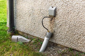 Fibre broadband conduit entry point and termination box on house wall © Tosh Lubek