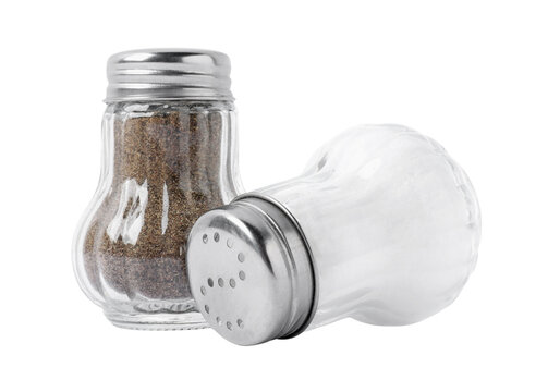 Pair of clear glass salt and pepper shakers condiment set isolated on transparent background PNG