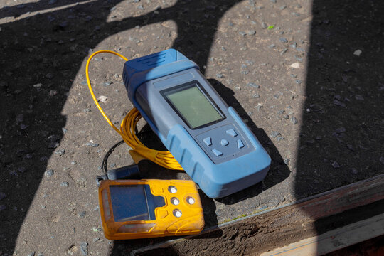 Optical power meter and visual fault locator on telecoms chamber edge