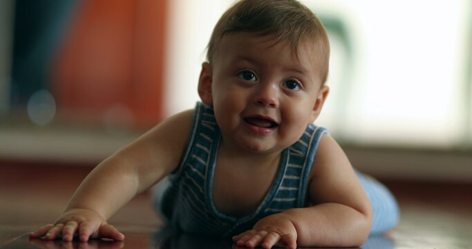 Cute baby boy learning to crawl at home