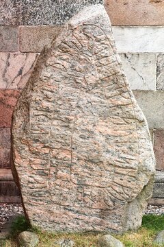 Runestone located at the church in Alum, Denmark