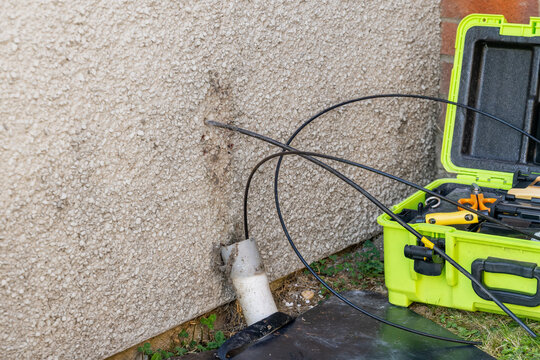 Open external termination point with fibre cable at swept entry duct