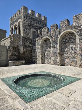 Stone fortress wall and water basin in Rabati Castle courtyard, Akhaltsikhe, Georgia