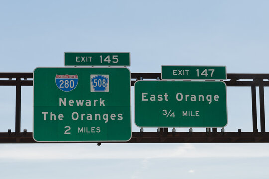 signs on the Garden State Parkway in New Jersey for exit 145 for I-280 and CR 508 to Newark and The Oranges, and exit 147 to East Orange