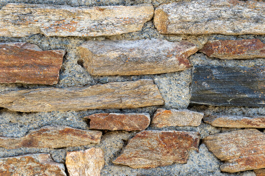 A section of stonework on an old French country stone house.