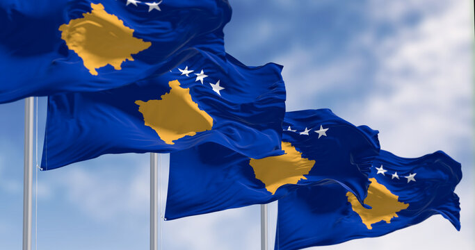 Kosovo national flags waving on a clear day