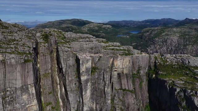 Aerial panorama of Preikestolen&rsquo;s sheer granite cliffs above Lysefjord, Rogaland, on a clear summer day.