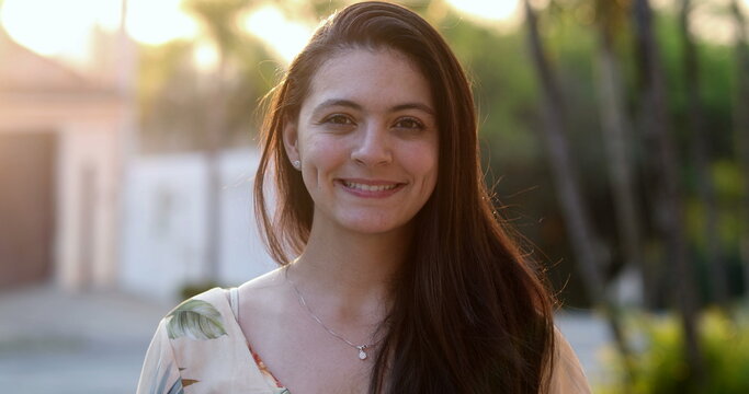 Casual authentic woman smile outside feeling happy portrait