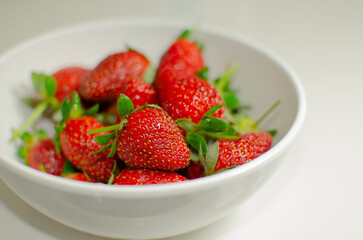 Close-up of fresh red strawberries on the table, an irresistible temptation for fruit lovers. © ND7 Studio