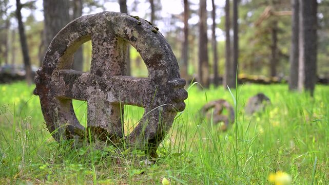 Ancient stone cross in Vormsi cemetery in Estonia