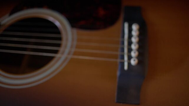 Polishing Acoustic Guitar Body with Microfiber Cloth Close Up Shot with Cinema Camera