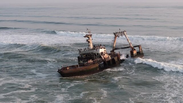 Aerial orbiting shot of the Zeila shipwreck on the Skeleton Coast in Namibia, southwest Africa.	