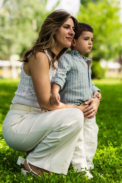 Mother and child embracing outdoors feeling