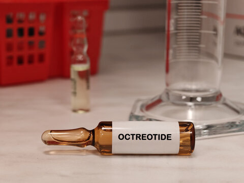 OCTREOTIDE somatostatin analogue for neuroendocrine and hormonal disorders in an injectable vial medical ampoule on a clinical laboratory table