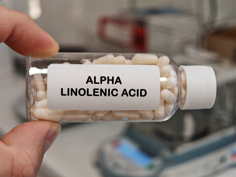 ALPHA LINOLENIC ACID hard capsule essential omega 3 fatty acid supplement for heart and nutritional health in a pharmacy laboratory