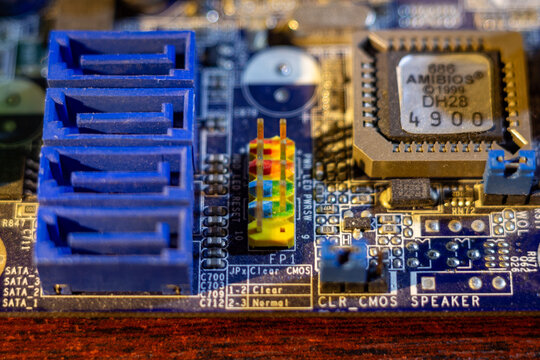 Computer motherboard with blue sata connectors and amibios chip on circuit board