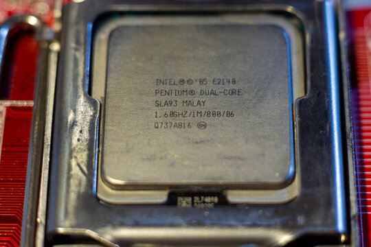 Intel pentium dual core e2140 processor chip mounted in socket on motherboard