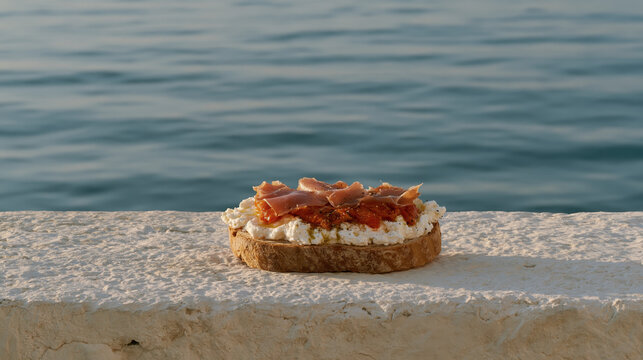 mediterranean breakfast toast with ricotta roasted pepper and prosciutto by sea